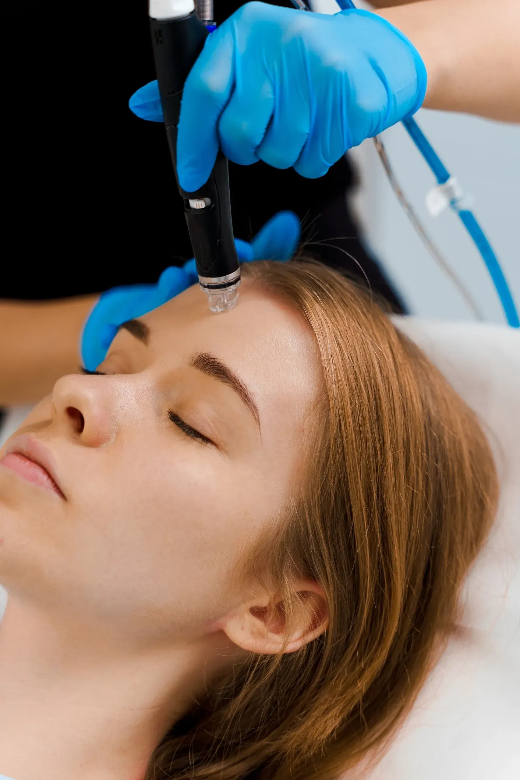 Portrait of a confident patient with clear, radiant skin after a Hydrafacial at Mint Aesthetics & Skin Indianapolis