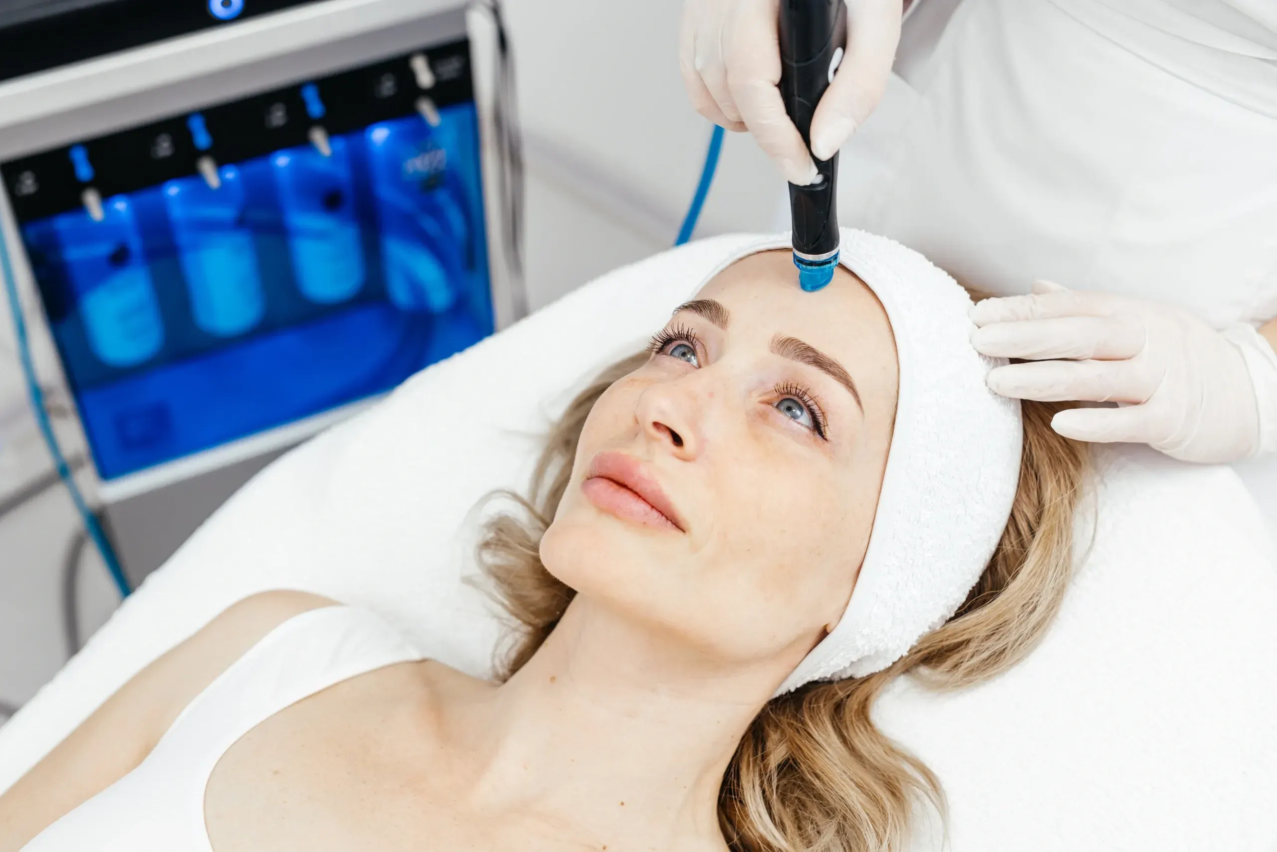 Woman receiving a Hydrafacial Syndeo treatment at Mint Aesthetics & Skin in Indianapolis, IN